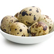 Quail eggs on white background